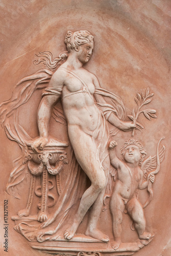 Terracotta half-relief, nude woman and boy, in Impruneta, Italy