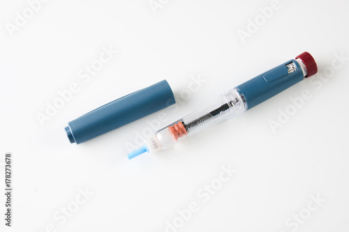 Insulin pen or insulin injector isolated on white