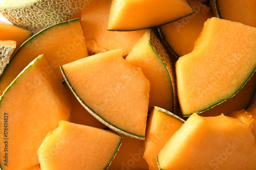 Sliced ripe melon as background