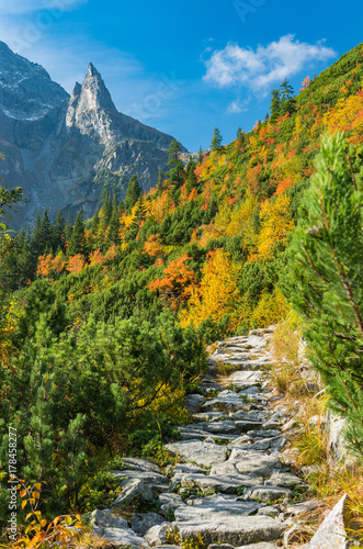 Tatra mountains, Mnich (Monk) peak over colorful autumn forest and footpath