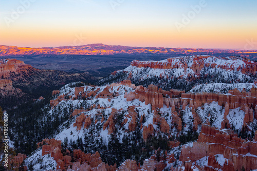 Colorful snowy Bryce Canyon National Park during sunset in Utah.