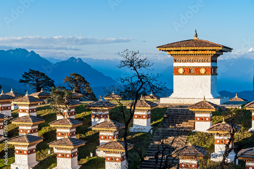 Sunset on Dochula Pass with Himalaya in background - Bhutan. In this pass, 108 memorial chortens or stupas known as Druk Wangyal Chortens have been built by Ashi Dorji Wangmo Wangchuk.