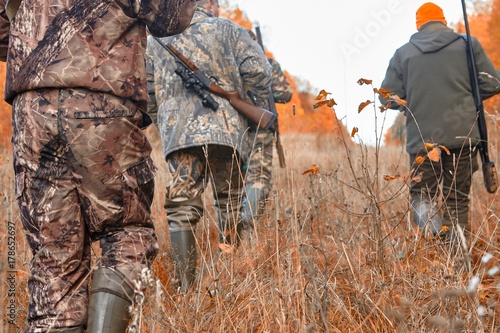 group of hunters during hunting in forest