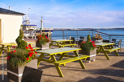 Cafe with view at harbour in tourist seaport town. Cobh, Ireland