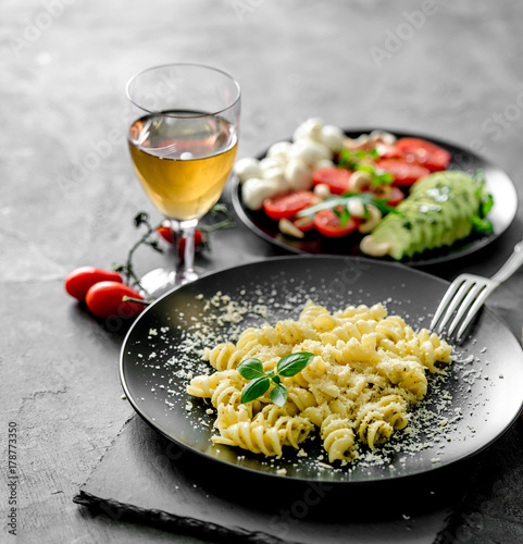 vegetarian dinner: pasta with parmesan cheese and vegetables 