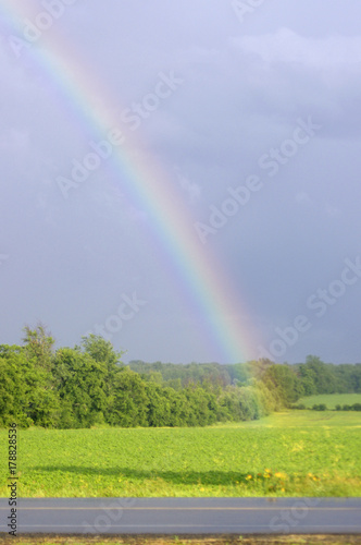 rainbow in country field 