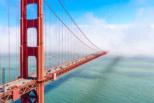 Golden Gate Bridge in clouds on a beautiful summer day - Panoramic view from Battery Spencer - California, USA