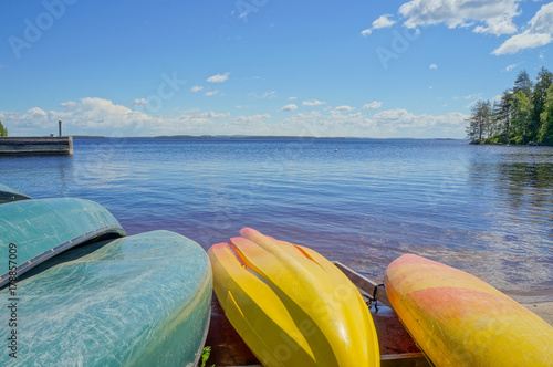 Colorful Kayaks on Lake Shore at Summer