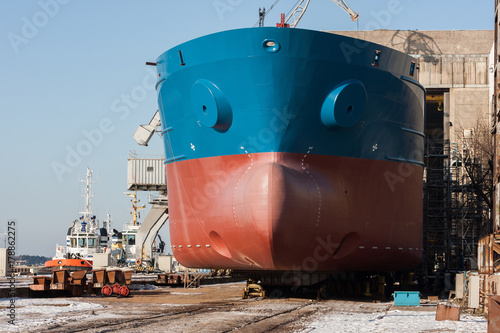 Large ship is being built in a dry dock