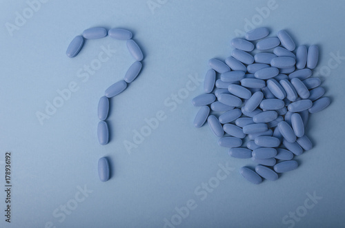 blue symbol of question mark from medical tablets concept. Copy space for text