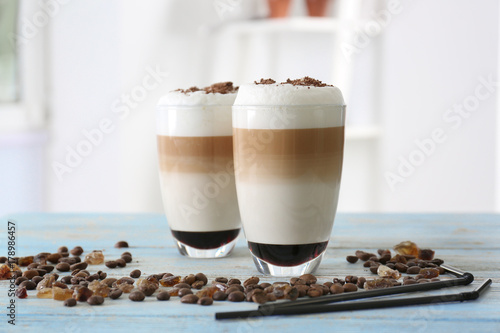 Glasses with latte macchiato on blurred background