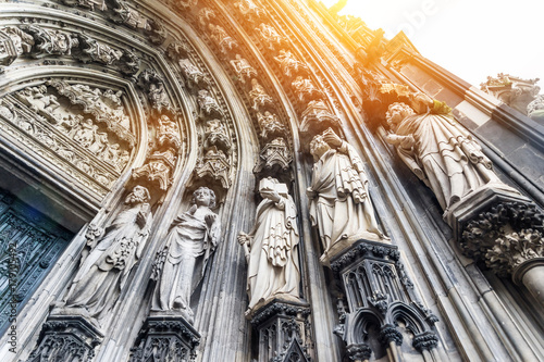 Europe culture concept - view of world cultural heritage, cologne cathedral under dramatic sun and morning blue cloudy sky in Germany