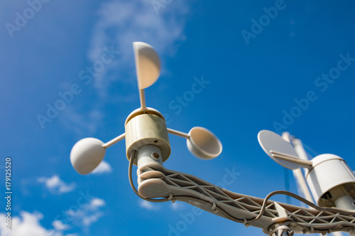 Sail boat anemometer on the blue sky background. Yacht equipment, sailors world.