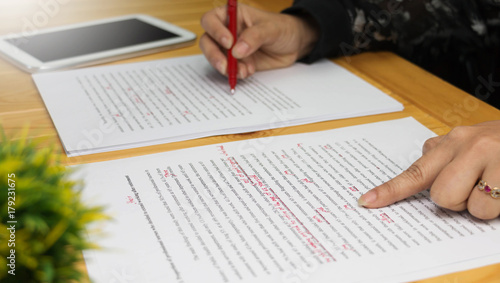 proofreading paper on table