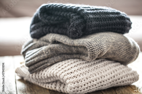 stack of cozy knitted sweaters