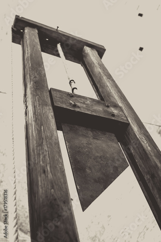 Black and white picture of a Guillotine in Palazzo dei Consoli in Gubbio, Umbria, Italy