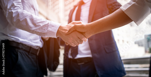 handshake of business People Colleagues Teamwork Meeting .Hold hand and shake hand in city