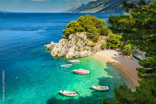 Tropical bay and beach with motorboats, Brela, Dalmatia region, Croatia