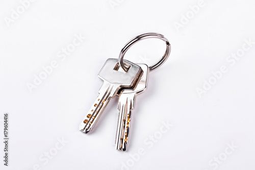 Doors keys isolated on white background. Twor keys on metal keyring isolated on white background.