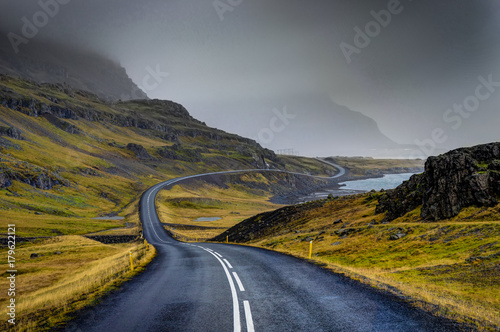 Empty Street with Icelandic Landscape during with misty mountain