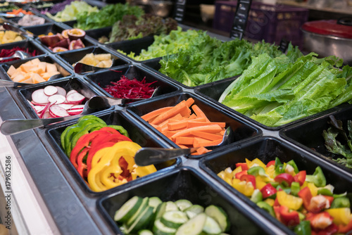 shelves of salad bar fresh vegetables