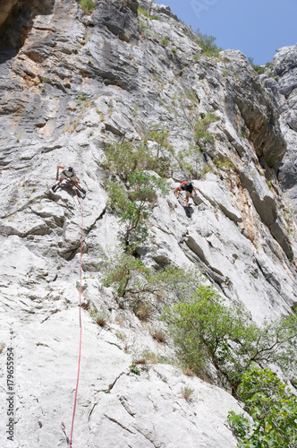 A rock climber on a wall.