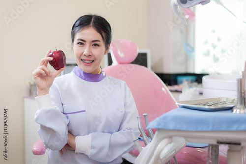 Female dentist crossing armin dental clinic