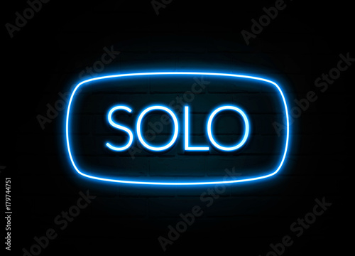 Solo - colorful Neon Sign on brickwall