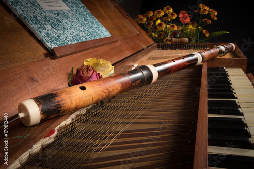 An old baroque clavichord and wooden traverse flute