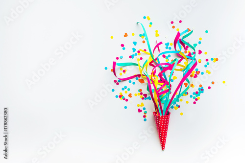 Celebration,party backgrounds concepts ideas with colorful confetti,streamers on white.Flat lay