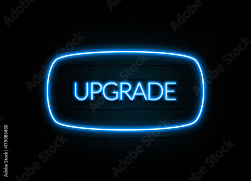 Upgrade - colorful Neon Sign on brickwall