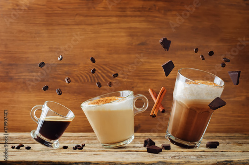 Different types of coffee with flying ingredients. Espresso, cappuccino and mocha coffee