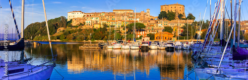 travel in Italy - picturesque tranquil Capodimonte village in lake Bolsena over sunset.