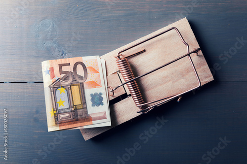 risky money - euro bill in mouse trap