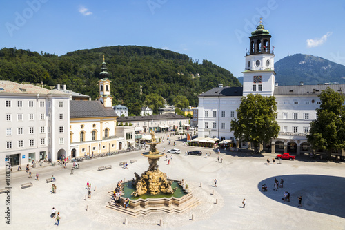 The Residenzplatz in Salzburg, Austria, with the Church of Saint Michael (Michaelskirche), the Residenzbrunnen fountain and the New Residence (Neue Residenz) with its prominent bell tower