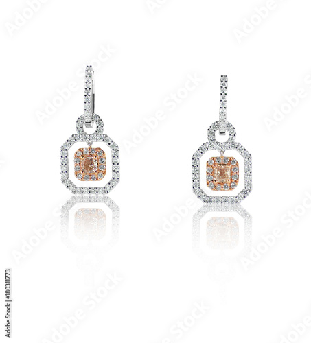Rose gold and white gold diamond earrings isolated on white