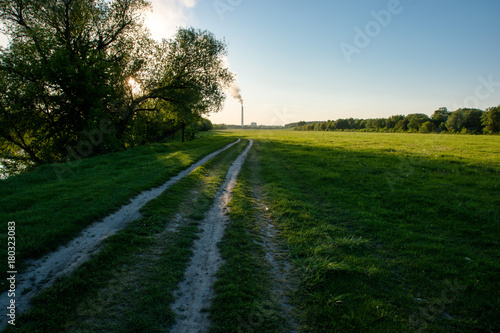 Soil roadway far to the field