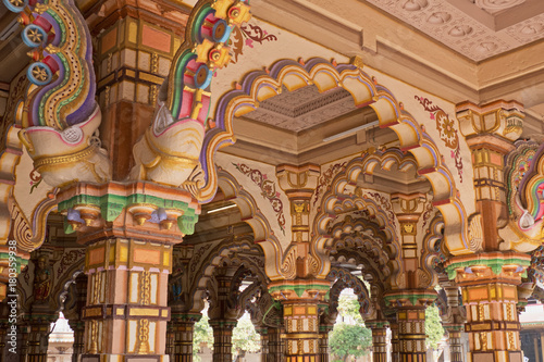 The brightly decorated Burmese teak archways in a Hindu temple in Ahmedabad, India