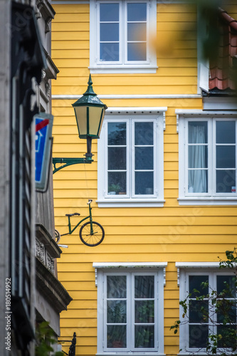 Windows of an old yellow house in Bergen