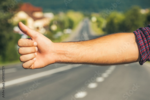 Hitchhiker sign on road