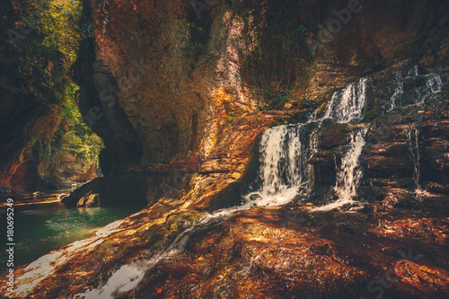 Martvili canyon in Georgia. Beautiful canyon with waterfall in rock and mountain river. Place to visit. Nature landscape. Travel background. Holiday, sport, recreation. Vintage retro toning filter