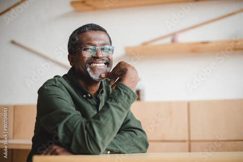 happy mature man in cafe