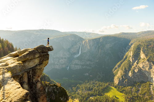 Hiker at the Glacier Point with View to Yosemite Falls and Valley in the Yosemite National Park, California, USA