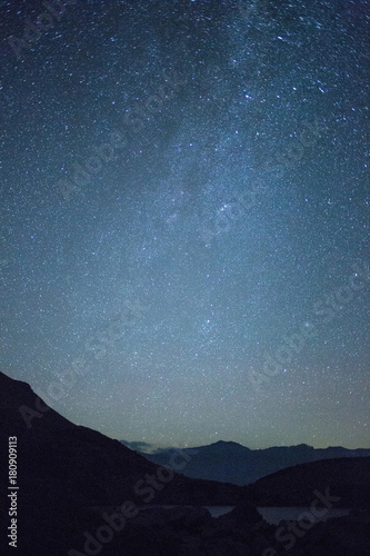 night landscape in the mountains. Starry sky
