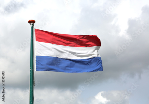 Dutch flag waving with blue sky
