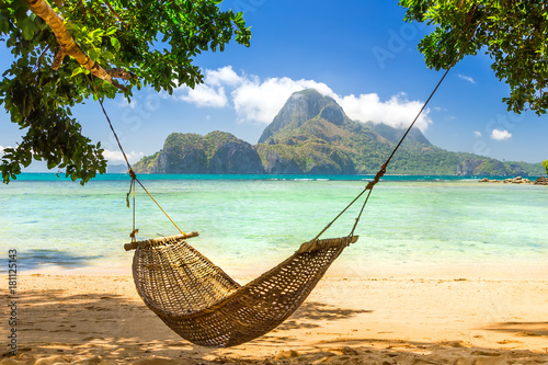 Traditional braided hammock in the shade on a tropical island