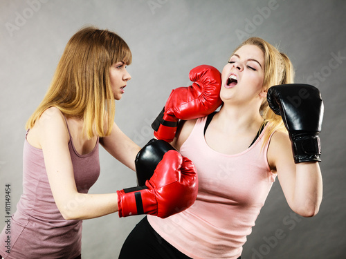 Two agressive women having boxing fight