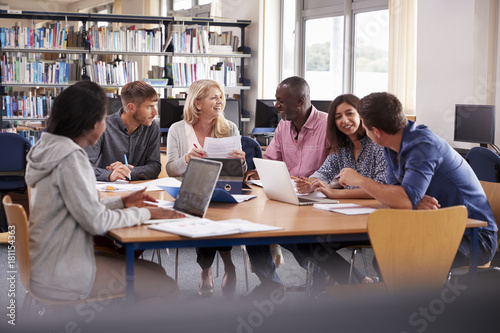 Group Of Mature College Students Collaborating On Project