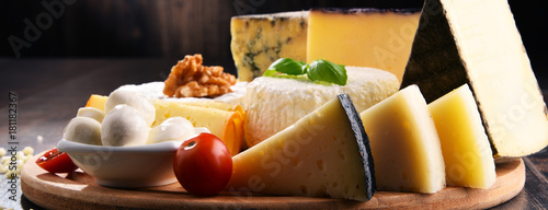 Different sorts of cheese on kitchen table