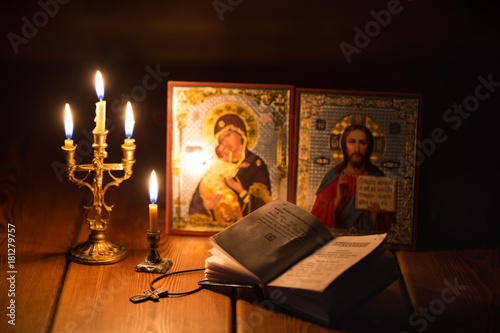 burning candle in a dark room, orthodox